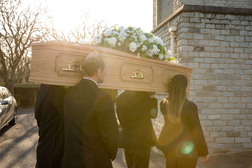 Photo depicting the William Purves team of funeral directors preparing to repatriate a loved one to Scotland in a coffin.