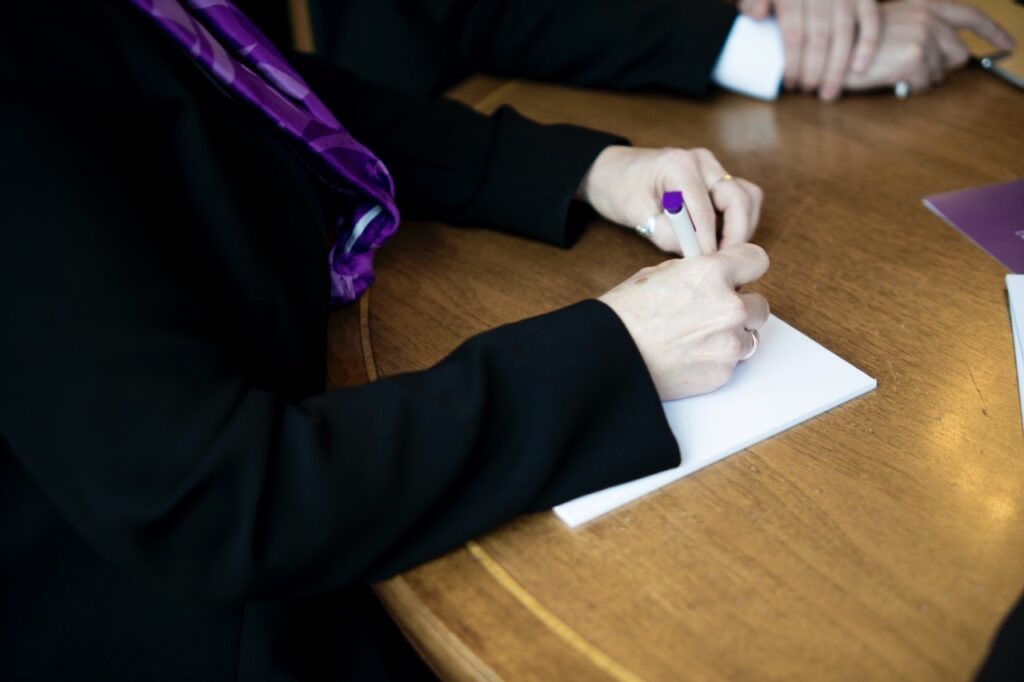 Photo of a repatriation specialist working out the cost for repatriation of a body