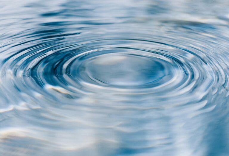 Ripples on the surface of a body of water - representing the link between water and hydrolysis